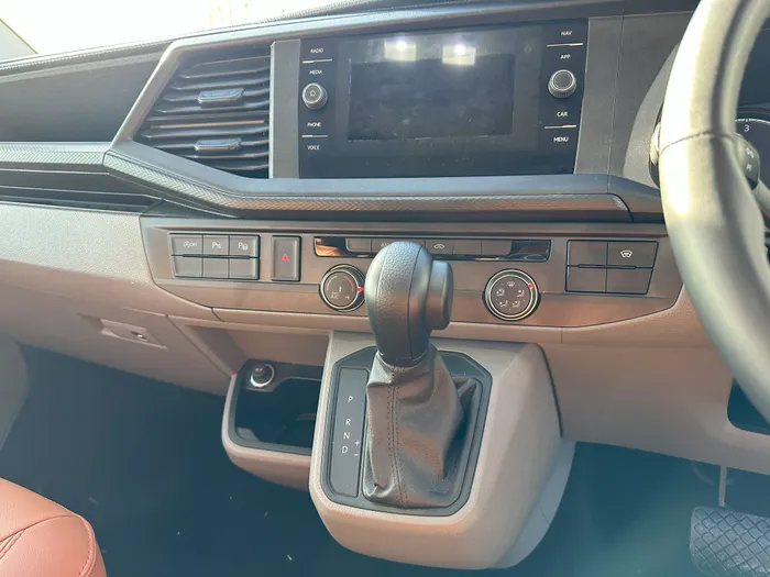 The automatic gearbox and dashboard, with the touchscreen and climate controls